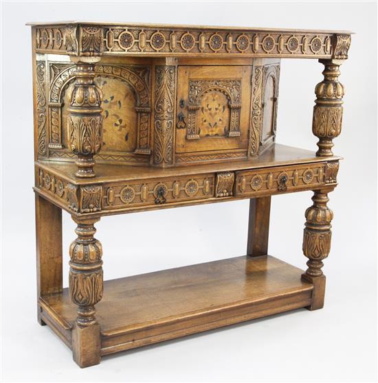 A 17th century style inlaid oak court cupboard, W.4ft 2in.